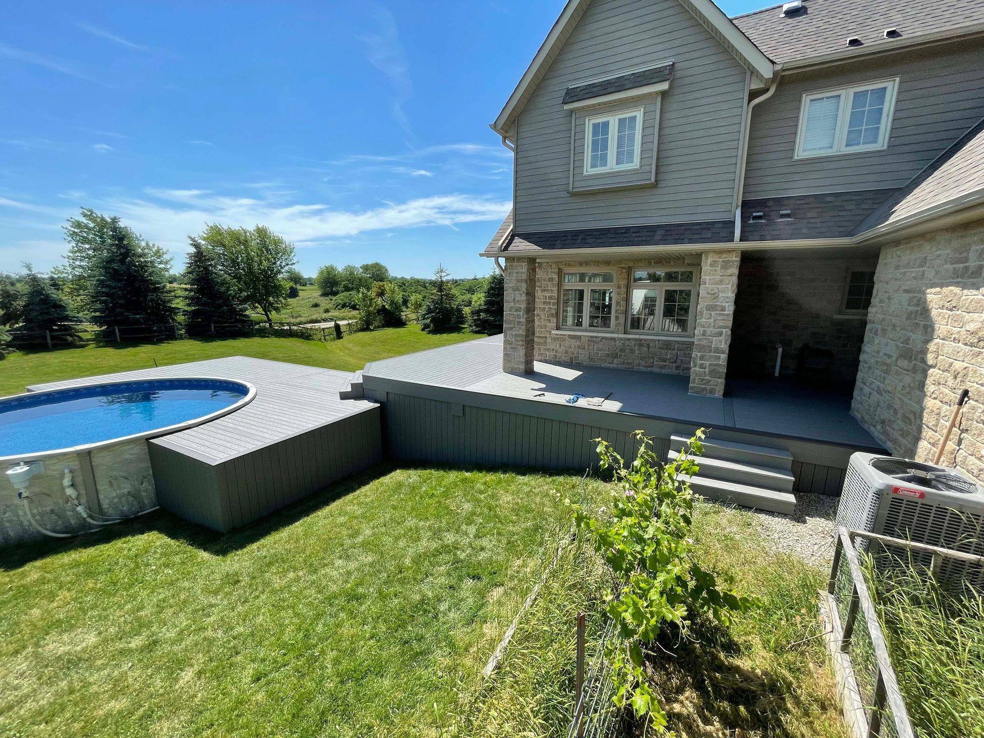 A large house with a swimming pool in the backyard.
