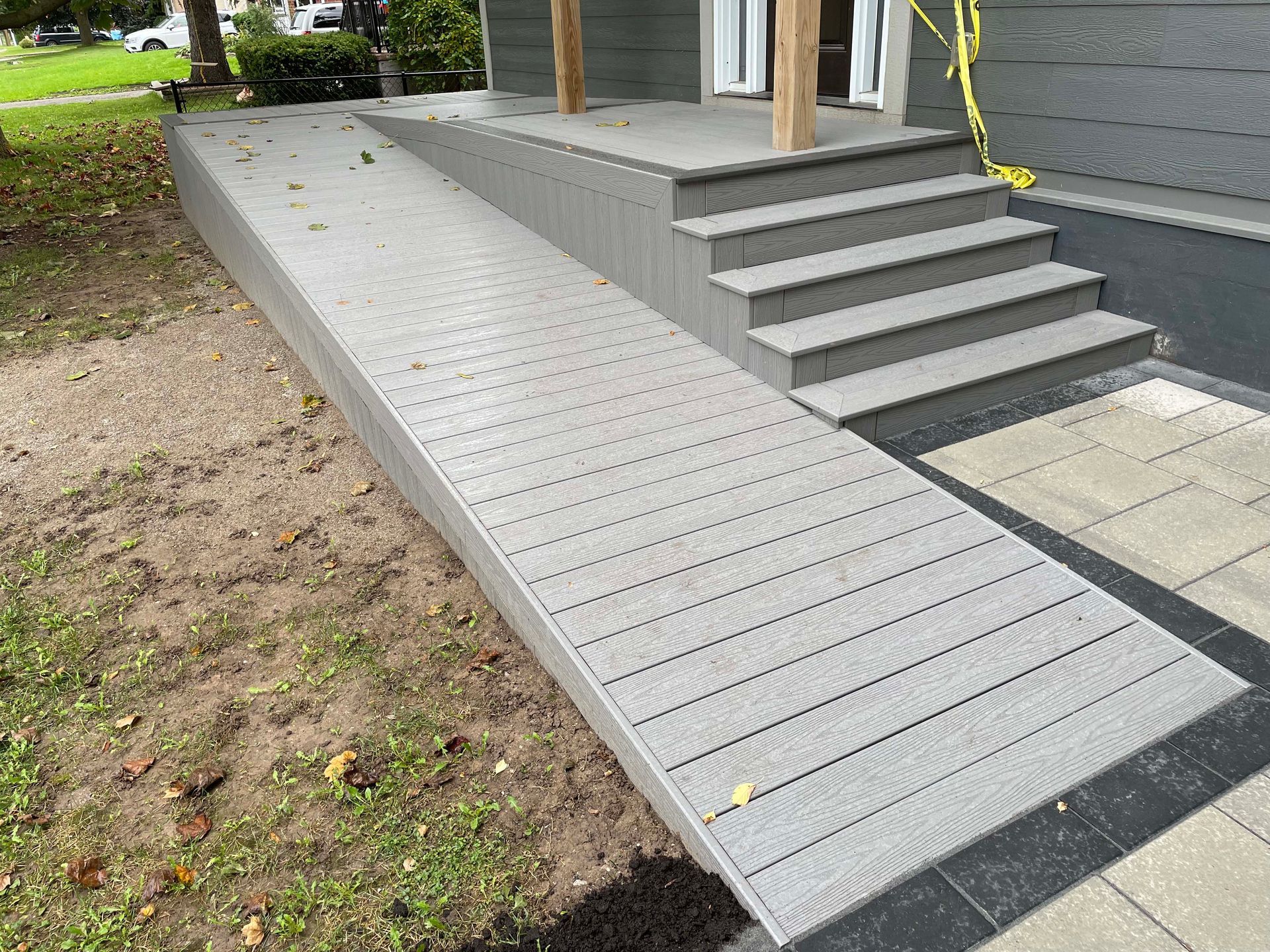There is a ramp leading to the front of the house.