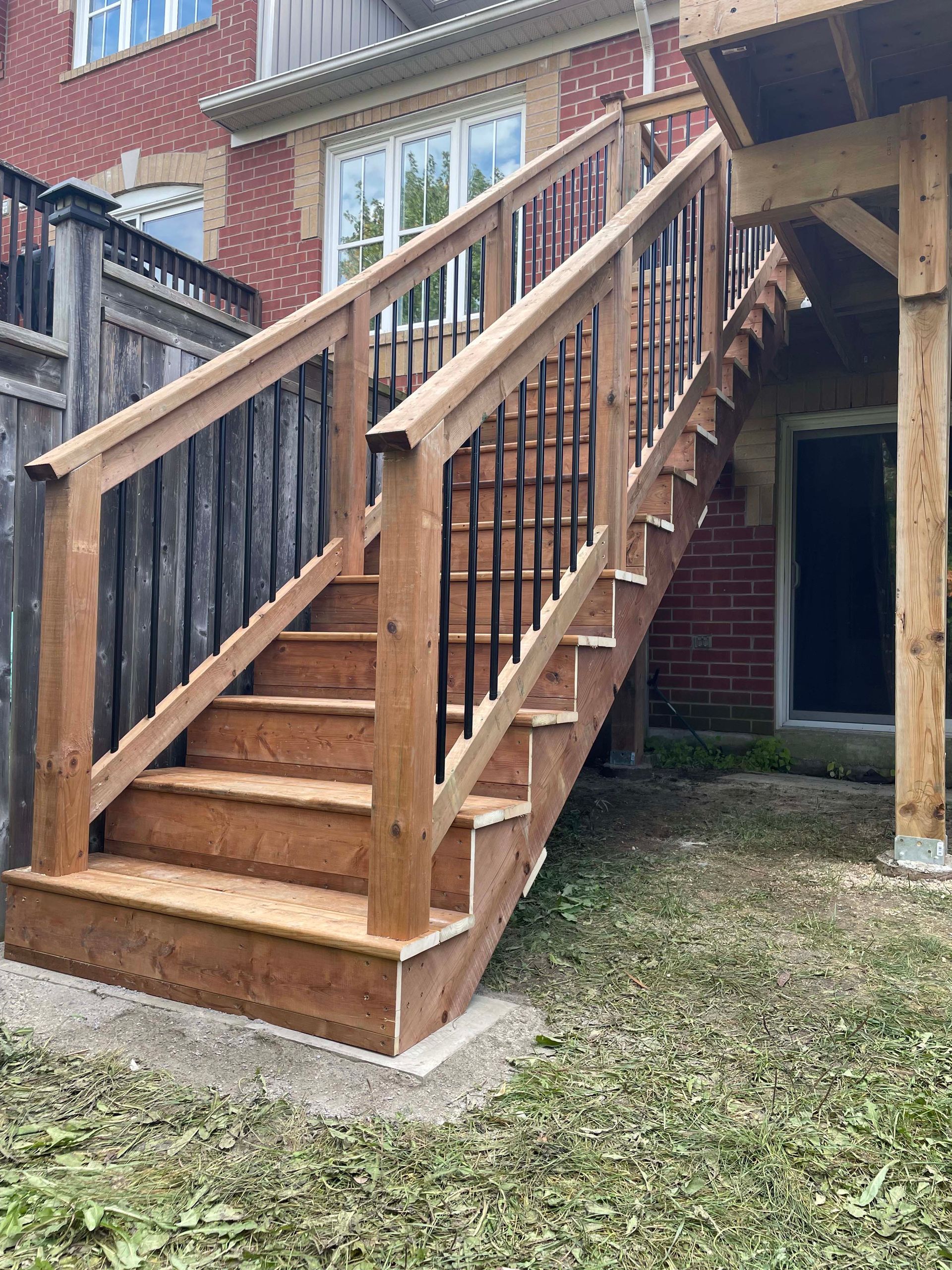 A wooden deck with stairs leading up to it.
