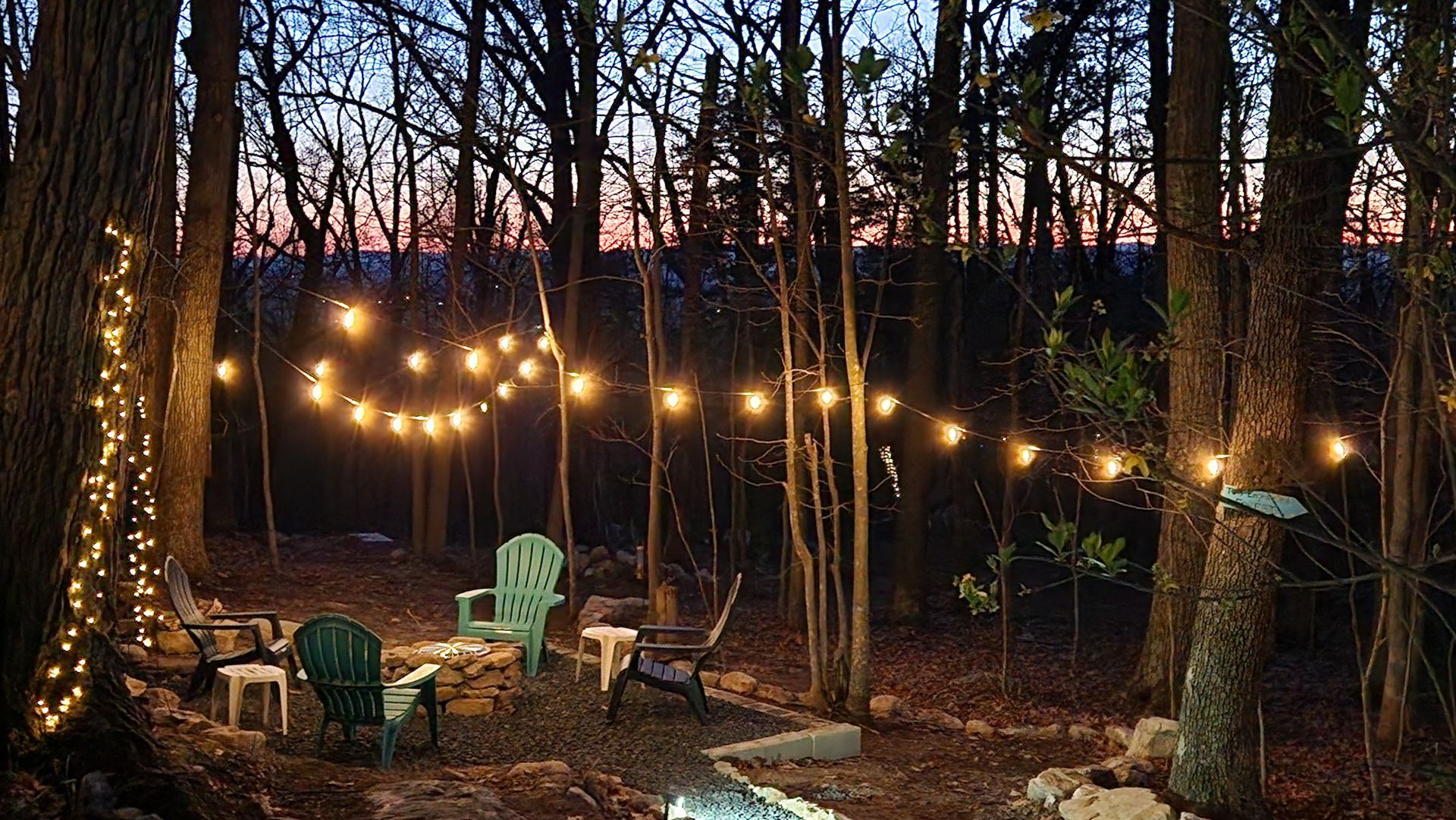 A person is roasting marshmallows over a fire pit.