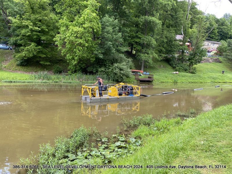 A yellow boat is floating on top of a body of water