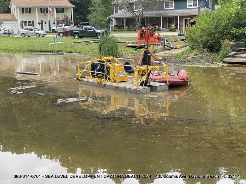 A yellow boat is floating on top of a body of water