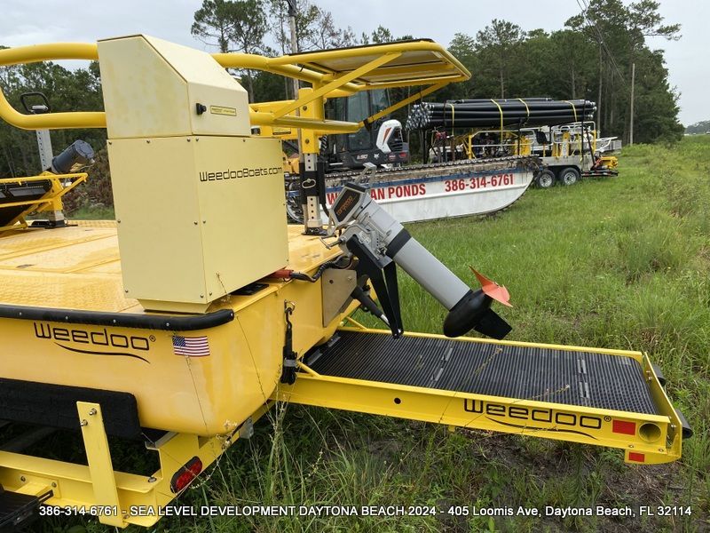 A yellow vehicle with the word weedoo on it