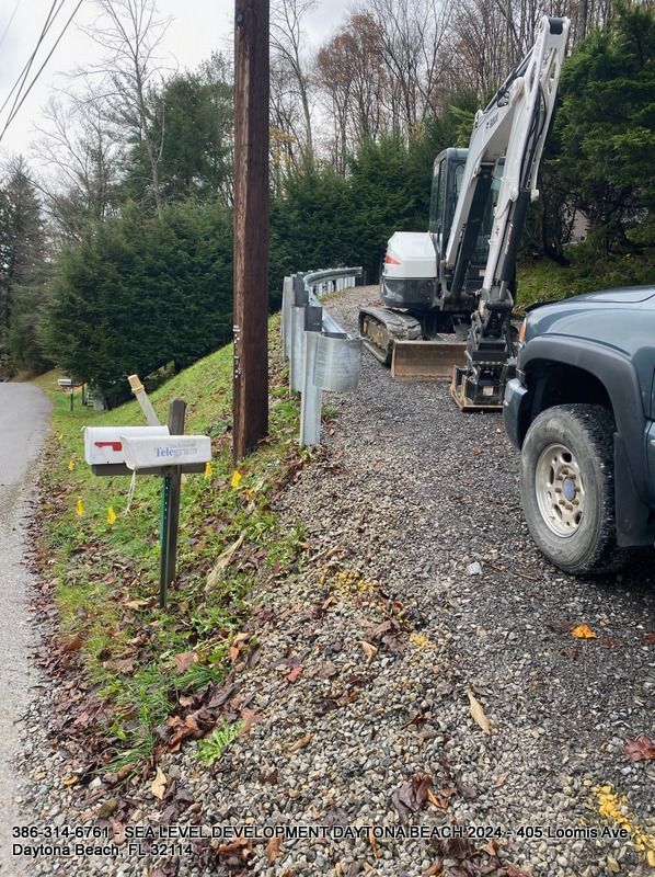 A truck is parked on the side of the road next to a mailbox.