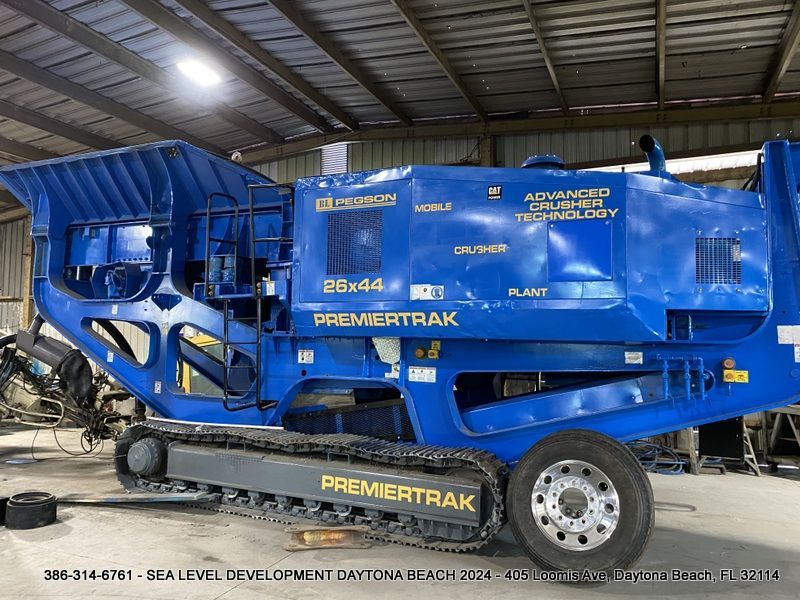 A blue machine with the word premierrak on it