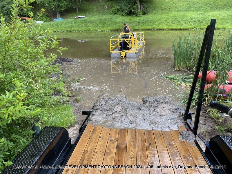 A boat is floating on top of a muddy river.
