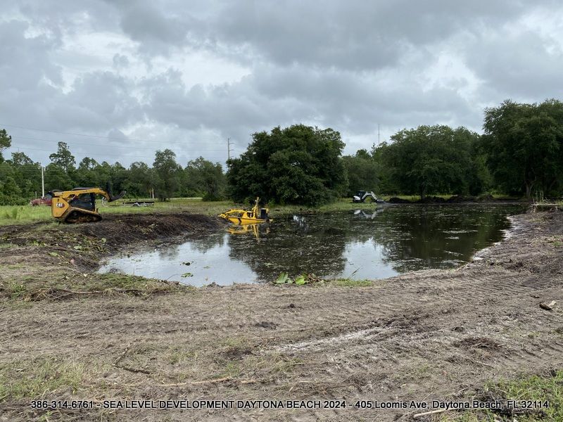 Team installing silt fences to protect waterways during land clearing.