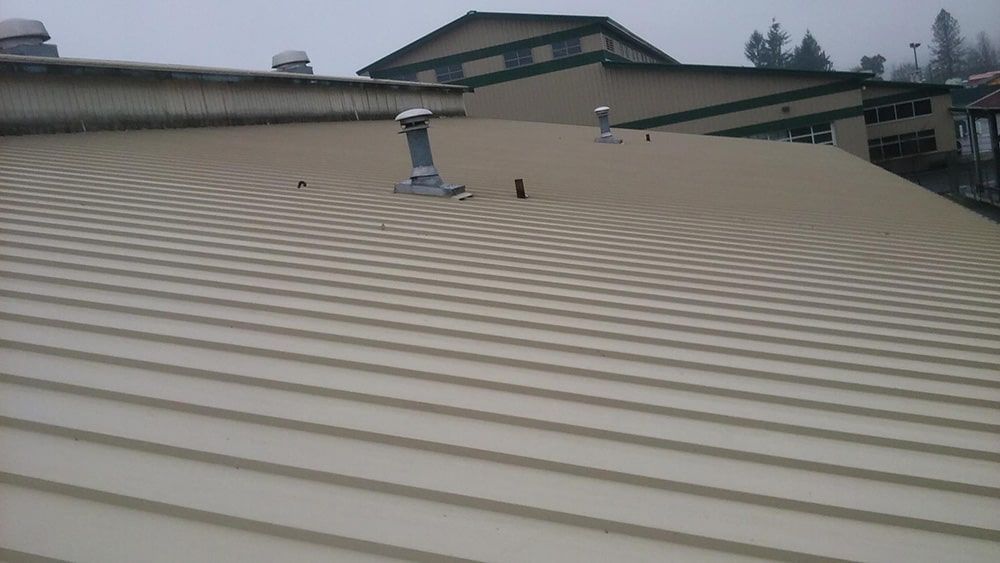 the roof of a building with a vent on it