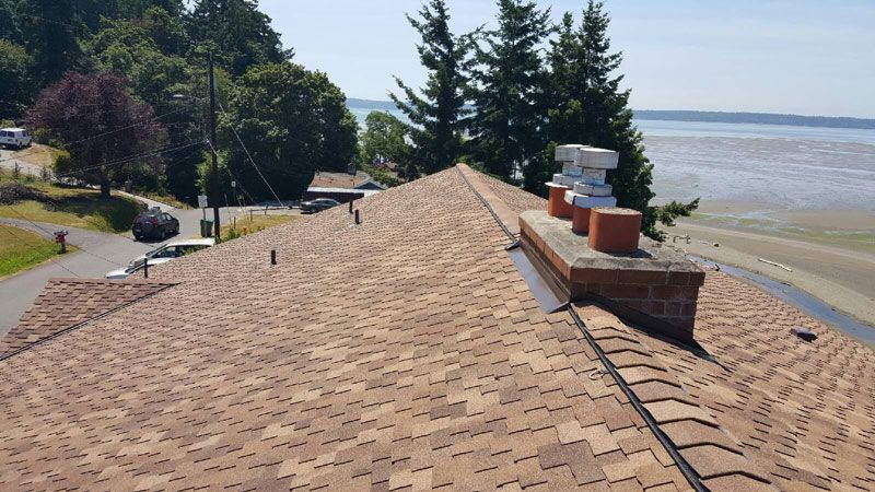the roof of a house with a view of the ocean
