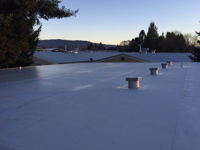 a white roof with a lot of vents on it