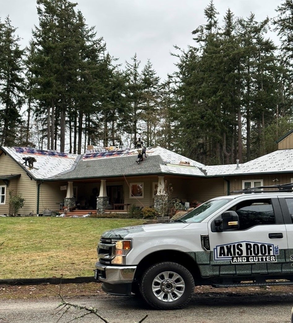 a truck is parked in front of a house that is being remodeled .