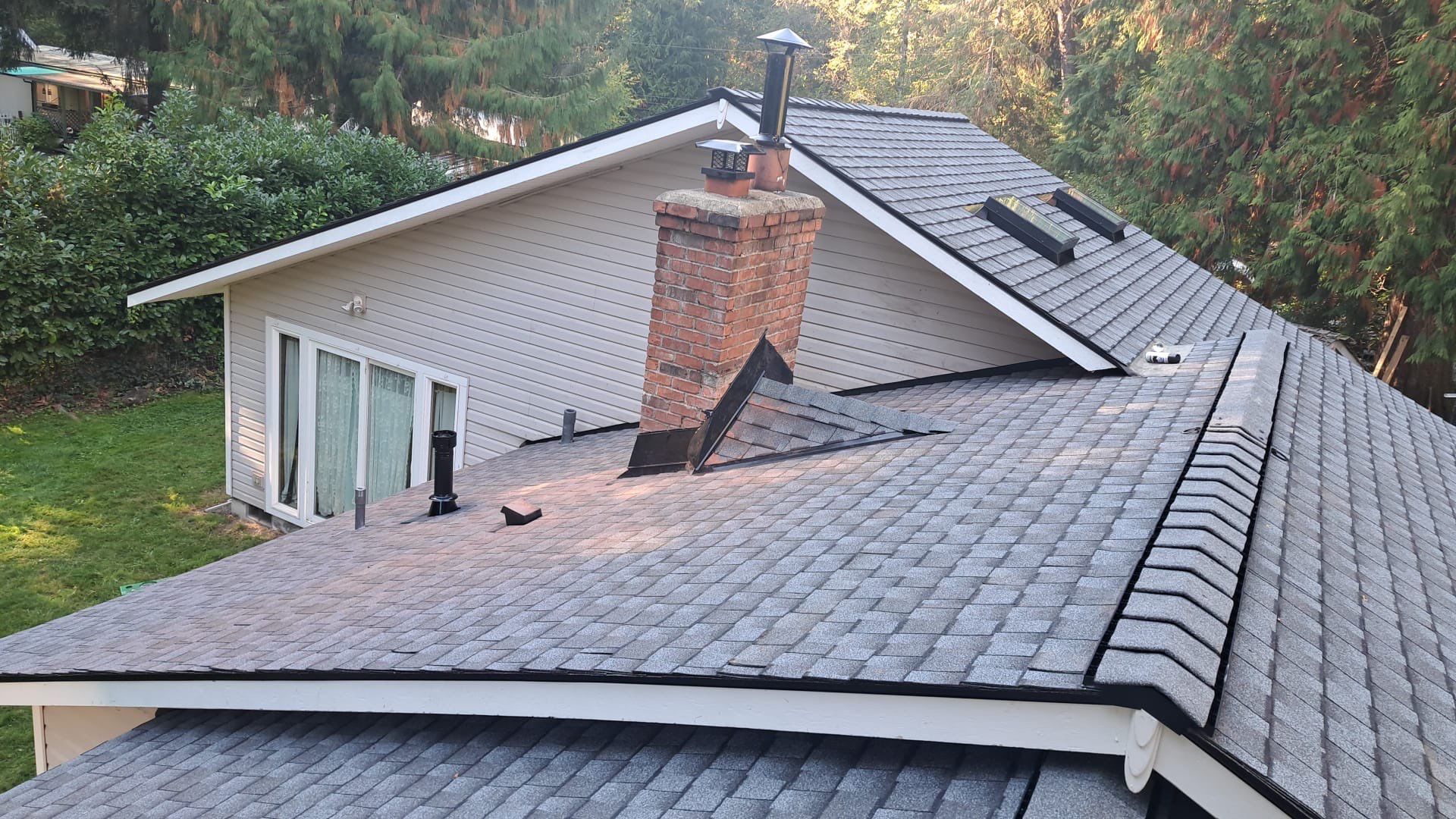 a roof of a house with a chimney on top of it .