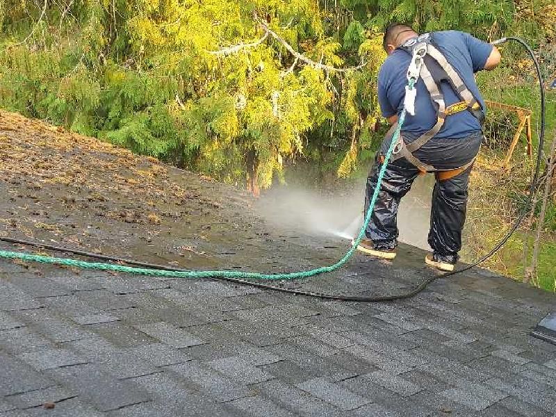 power washing on a roof