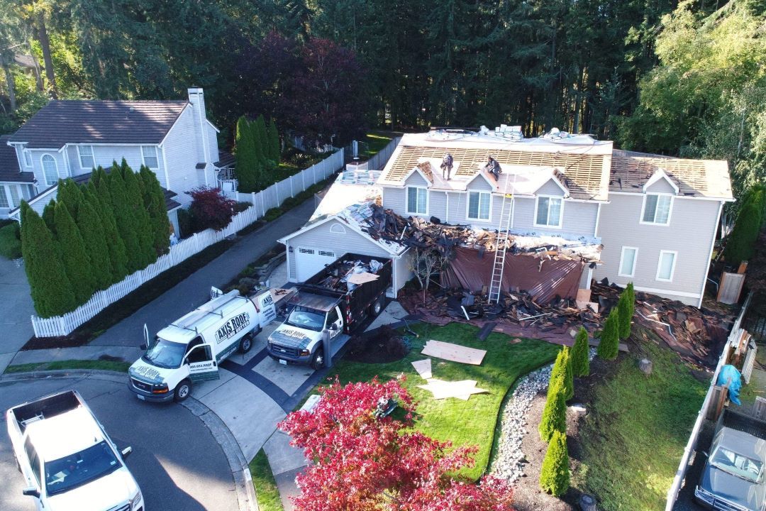 an aerial view of a house with a truck parked in front of it .