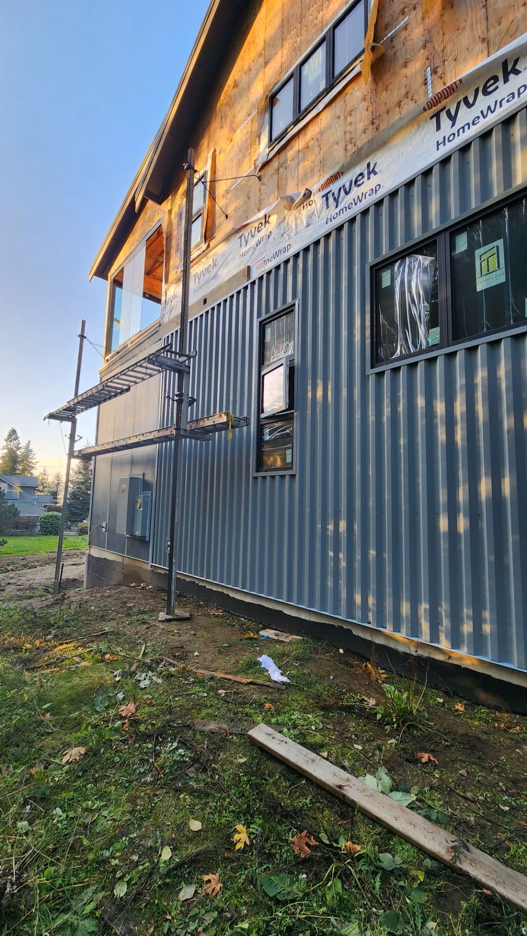 a large building is being built with a lot of windows .