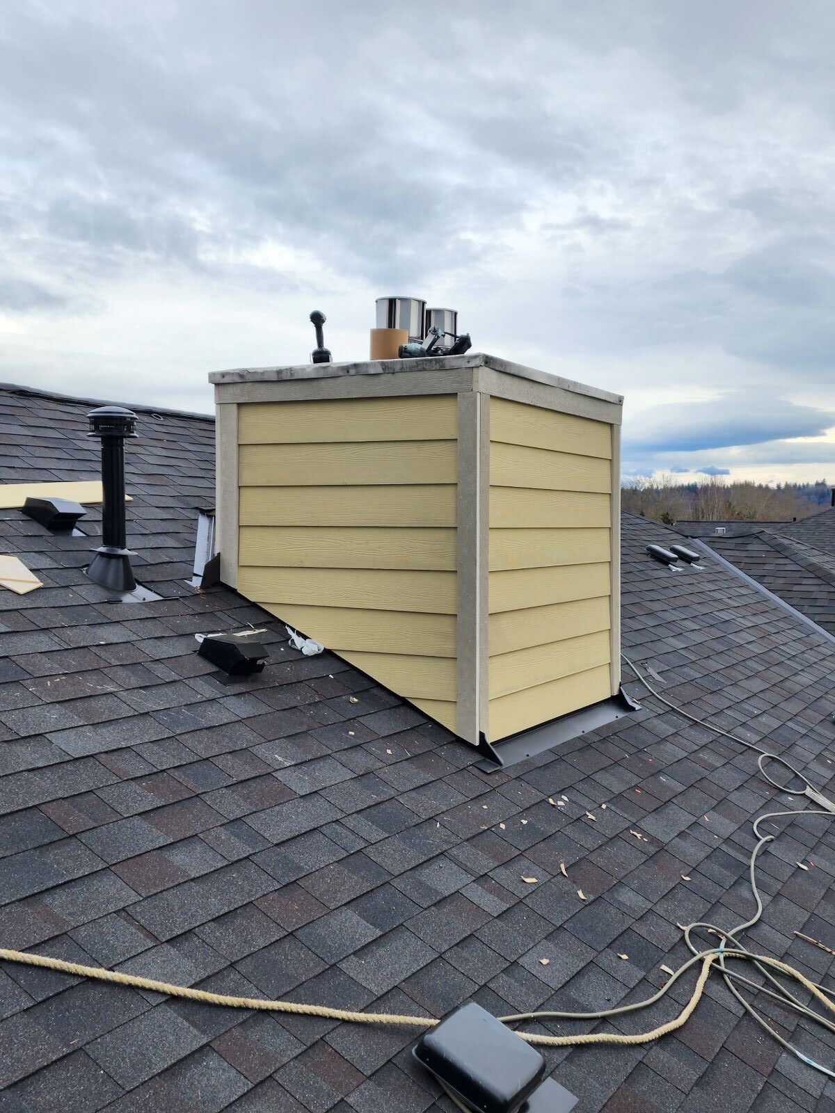 shingles installed around a chimney