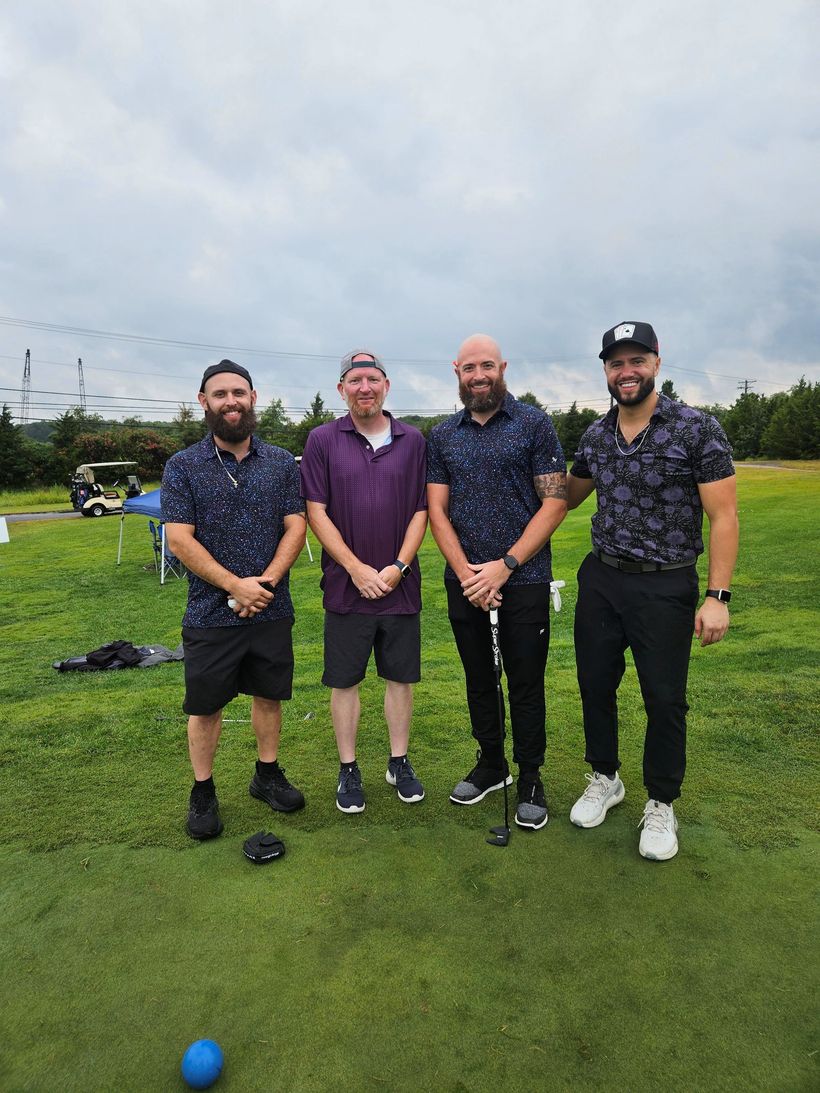 Four men on a golf course during the 2025 Remembering Jamie Foundation Golf Tournament at McCullough's Emerald Links Golf Course in Egg Harbor Township, New Jersey