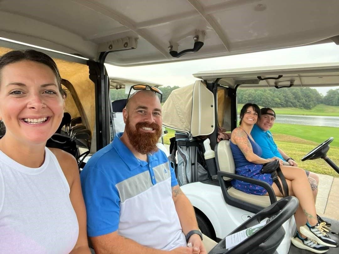 people riding in golf carts at the remembering jamie golf tournament at mcculloughs golf course in egg harbor township new jersey