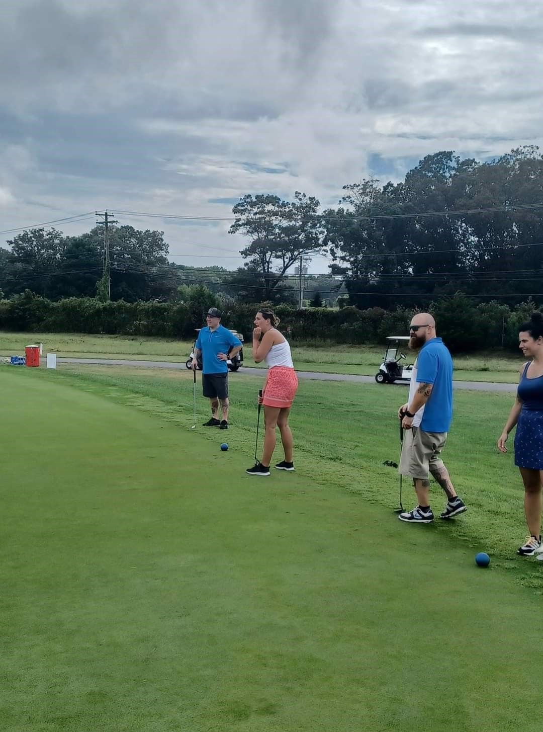 golfers playing in putting contest at the remembering jamie golf tournament at mcculloughs golf course in egg harbor township new jersey