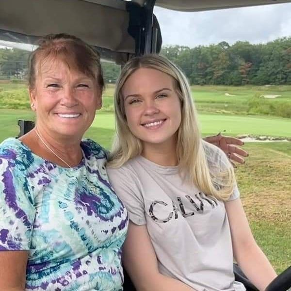 mom and daughter in golf cart at the remembering jamie golf tournament at mcculloughs golf course in egg harbor township new jersey