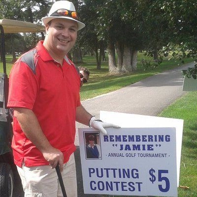 a man is standing next to a sign that says putting contest