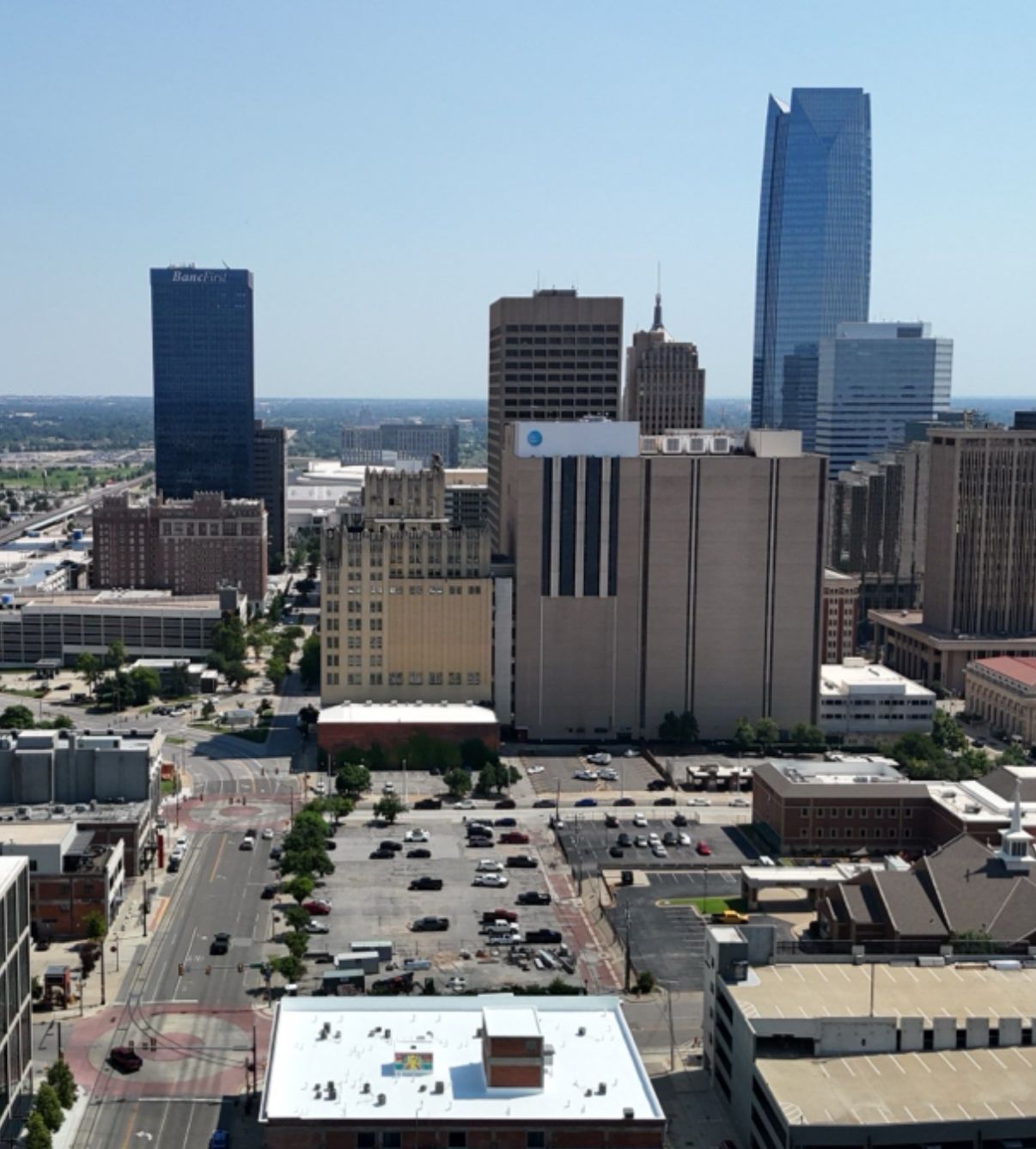 City skyline with tall buildings under a clear blue sky.