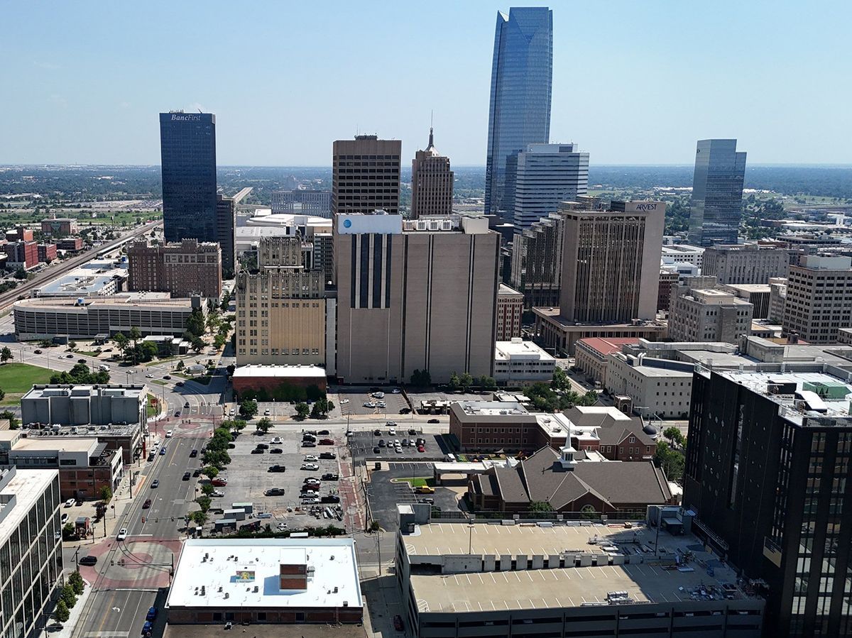 Aerial view of downtown Oklahoma City with tall skyscrapers and buildings.