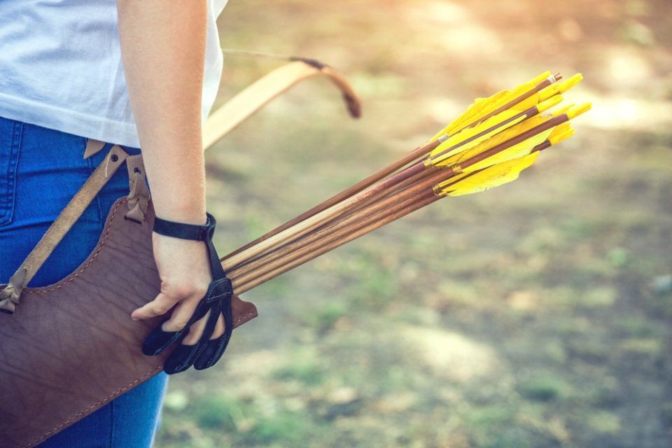 woman with archery equipment