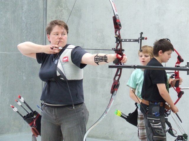 woman practicing archery