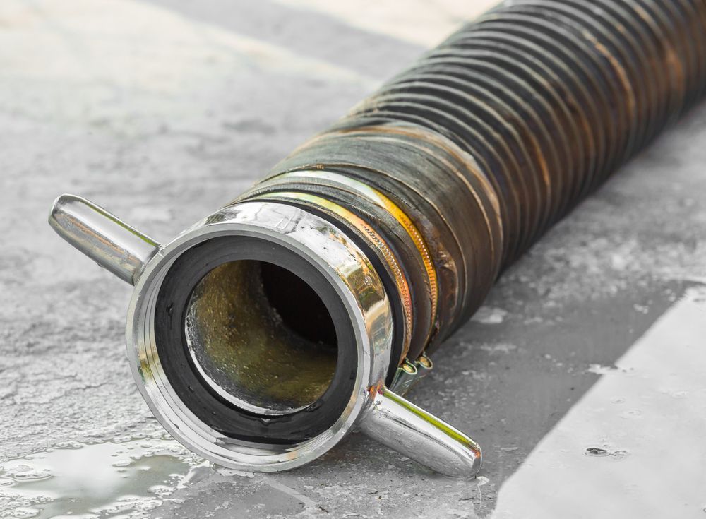 Close-up of a Black, Corrugated Hose With a Silver Connector  — Coastcut Concrete Cutting Pty Ltd in Newcastle, NSW