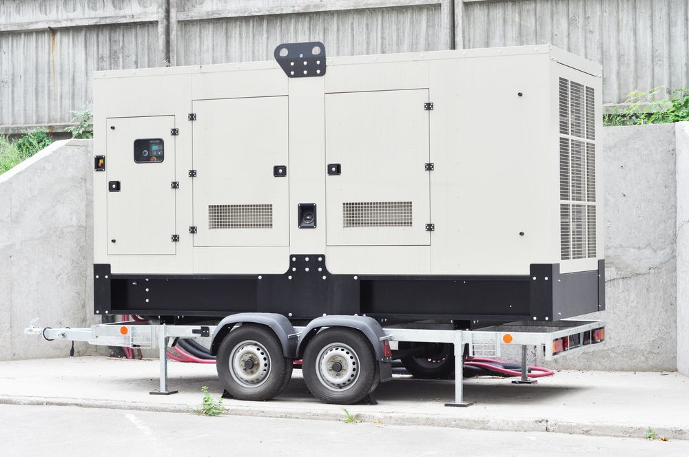 Large Beige Generator on a Trailer, Parked on Pavement — Coastcut Concrete Cutting Pty Ltd in Corlette, NSW