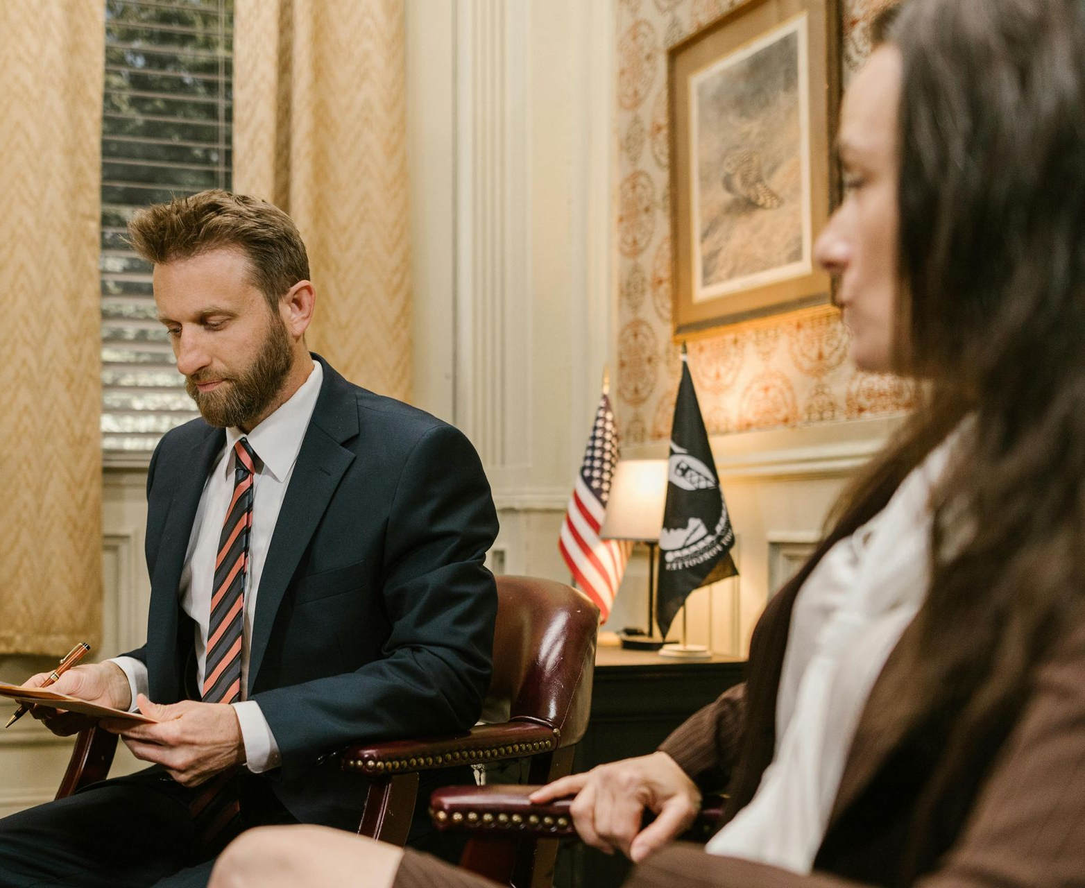 Dashboard view from a car driving at night; speedometer at 15 mph. In the background, a lit gas station.