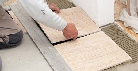 Floor tiling being installed