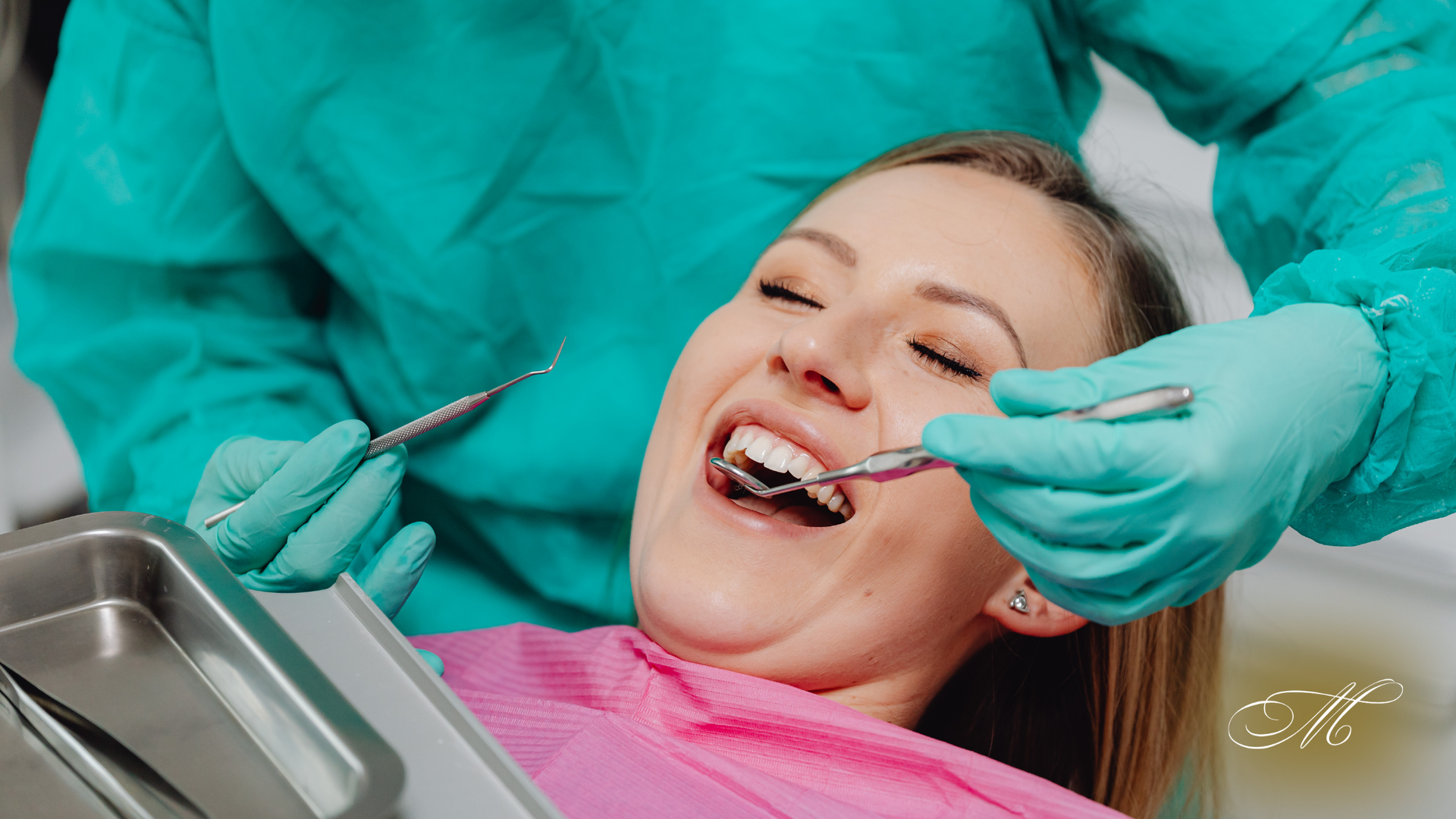 Woman in dentist chair having teeth examined with dental tools.