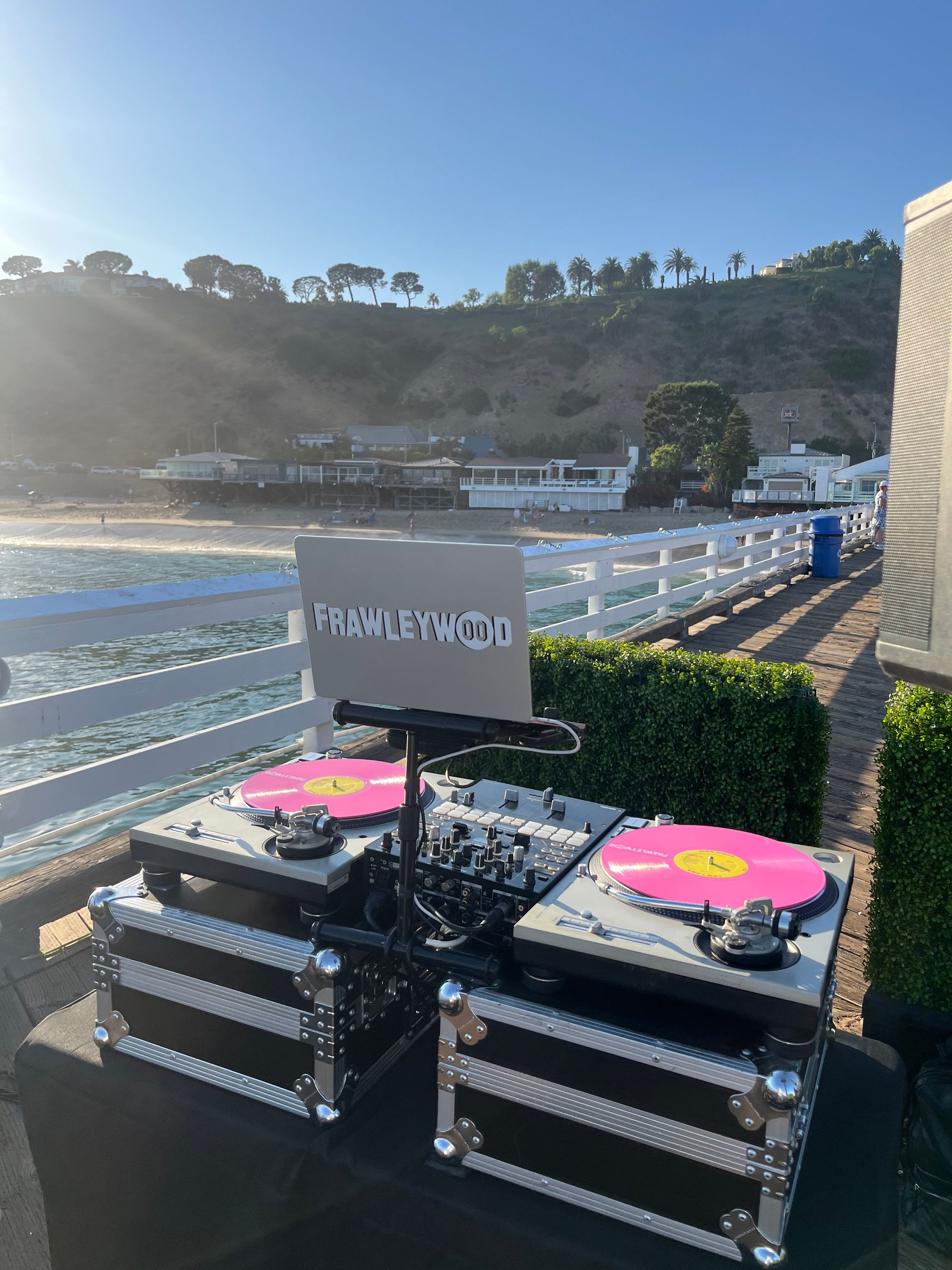 A couple of turntables sitting on top of each other on a beach.