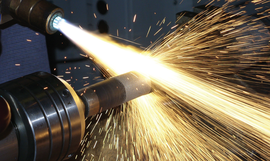 Man Spraying Metal — Indianapolis, IN — Christie Machine Works