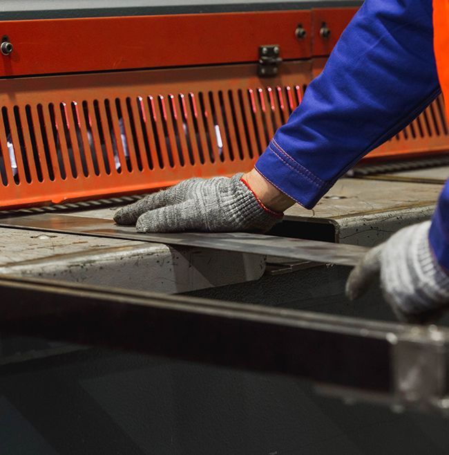 Worker Doing Metal Shearing — Indianapolis, IN — Christie Machine Works
