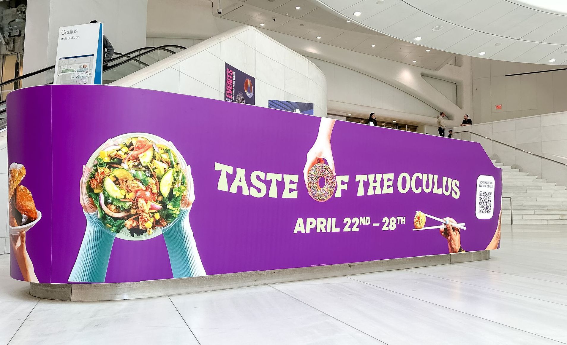 A purple sign that says taste of the oculus on it