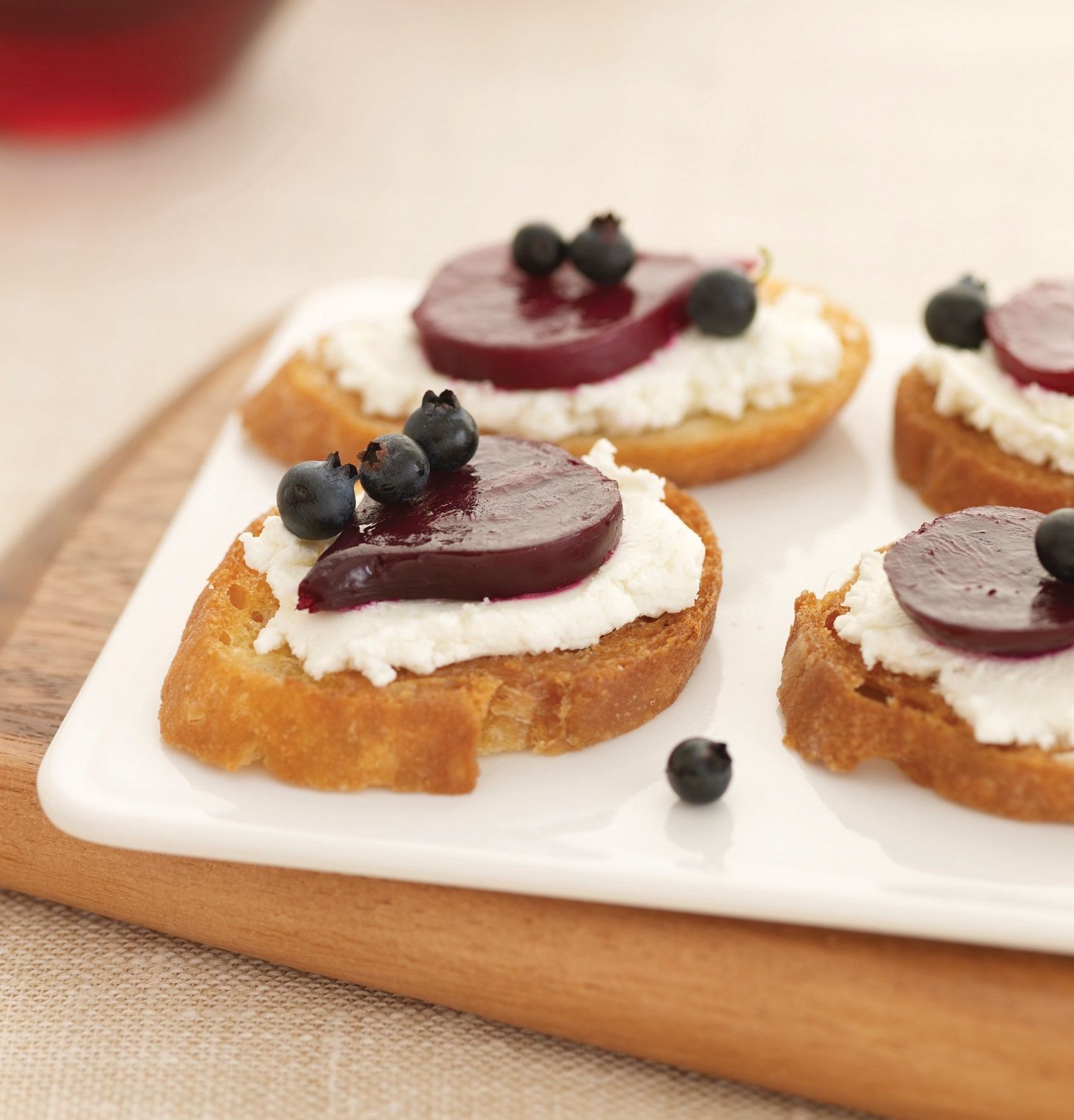 A close up of a plate of food with blueberries on top