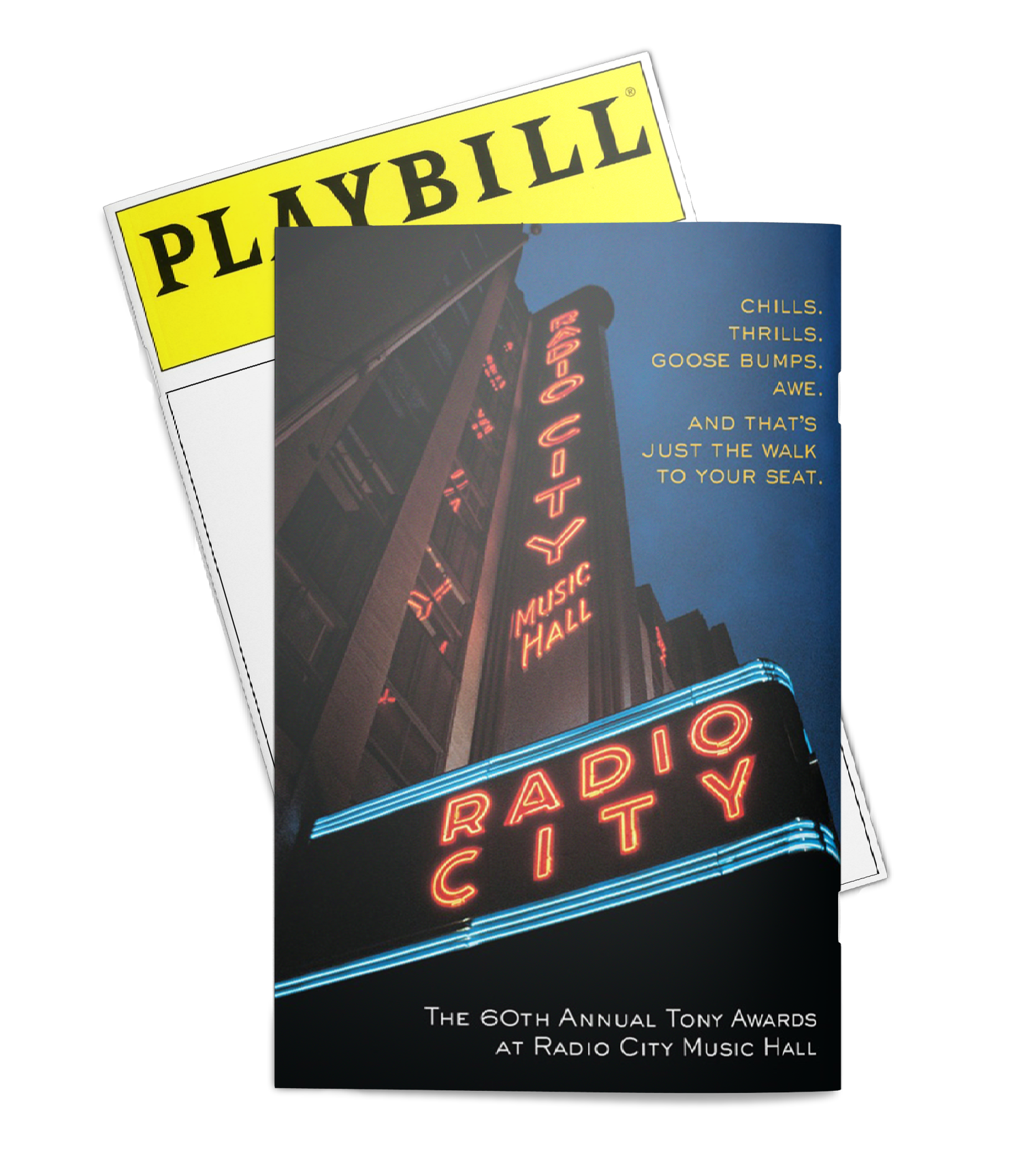 A playbill for radio city sits next to a ticket