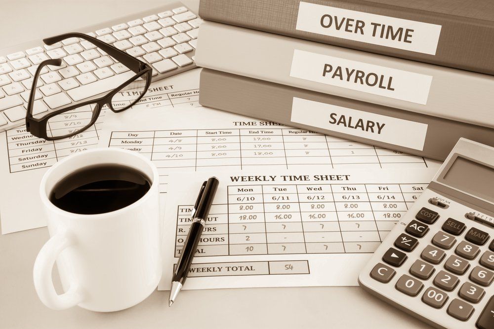 Payroll, Overtime, Salary and Time Sheet on table — Fraser Coast Accounting Group in Pialba, QLD