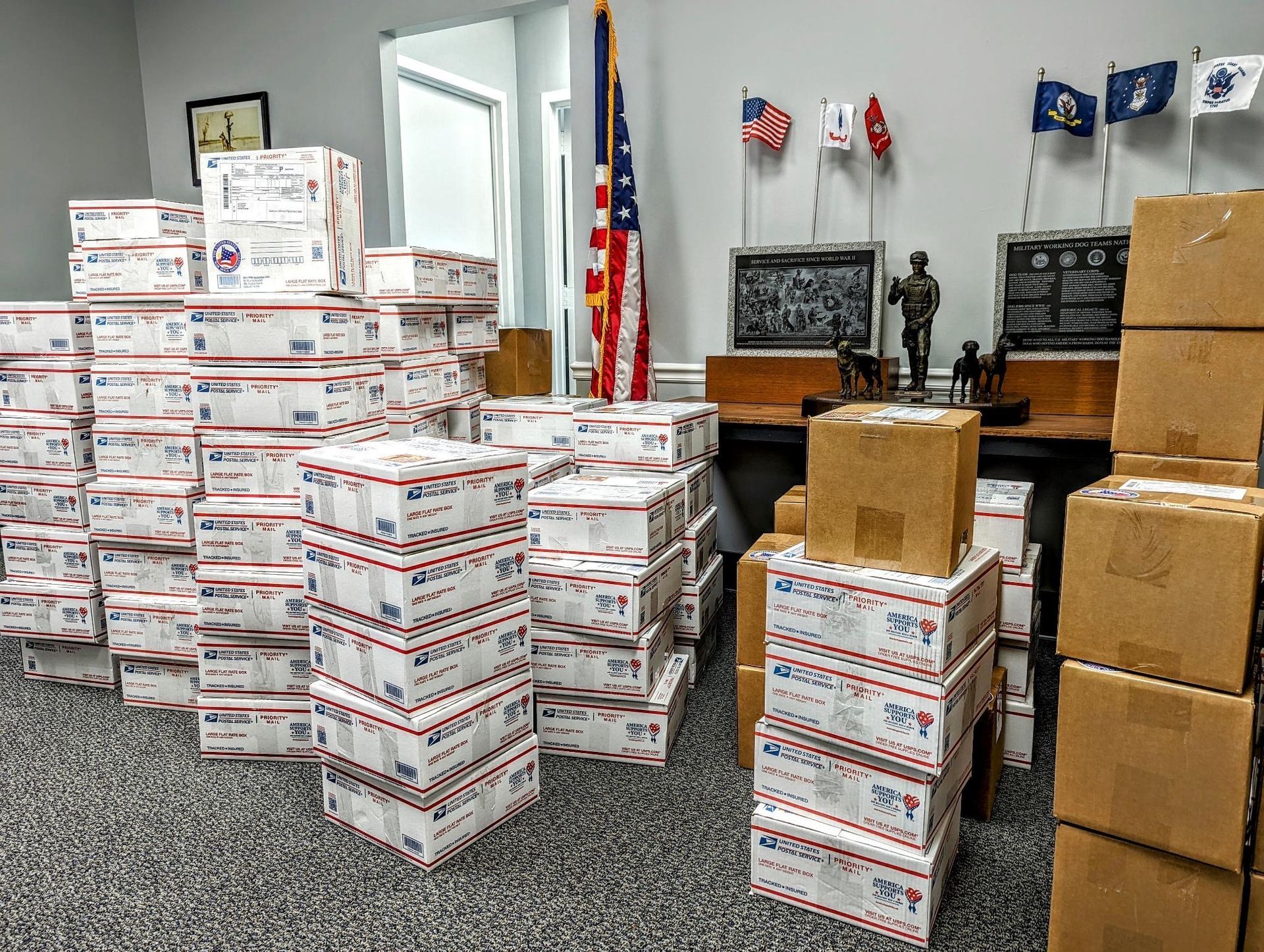 A bunch of boxes are stacked on top of each other in a room