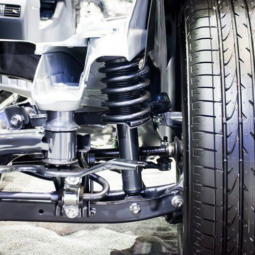 A Close Up Of A Car Suspension With A Tyre — P & M Performance & Mechanical In Bungalow, QLD