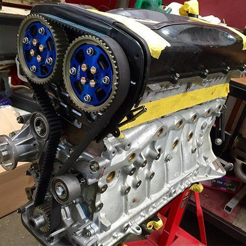 A Close Up Of A Car Engine With Blue Gears — P & M Performance & Mechanical In Bungalow, QLD