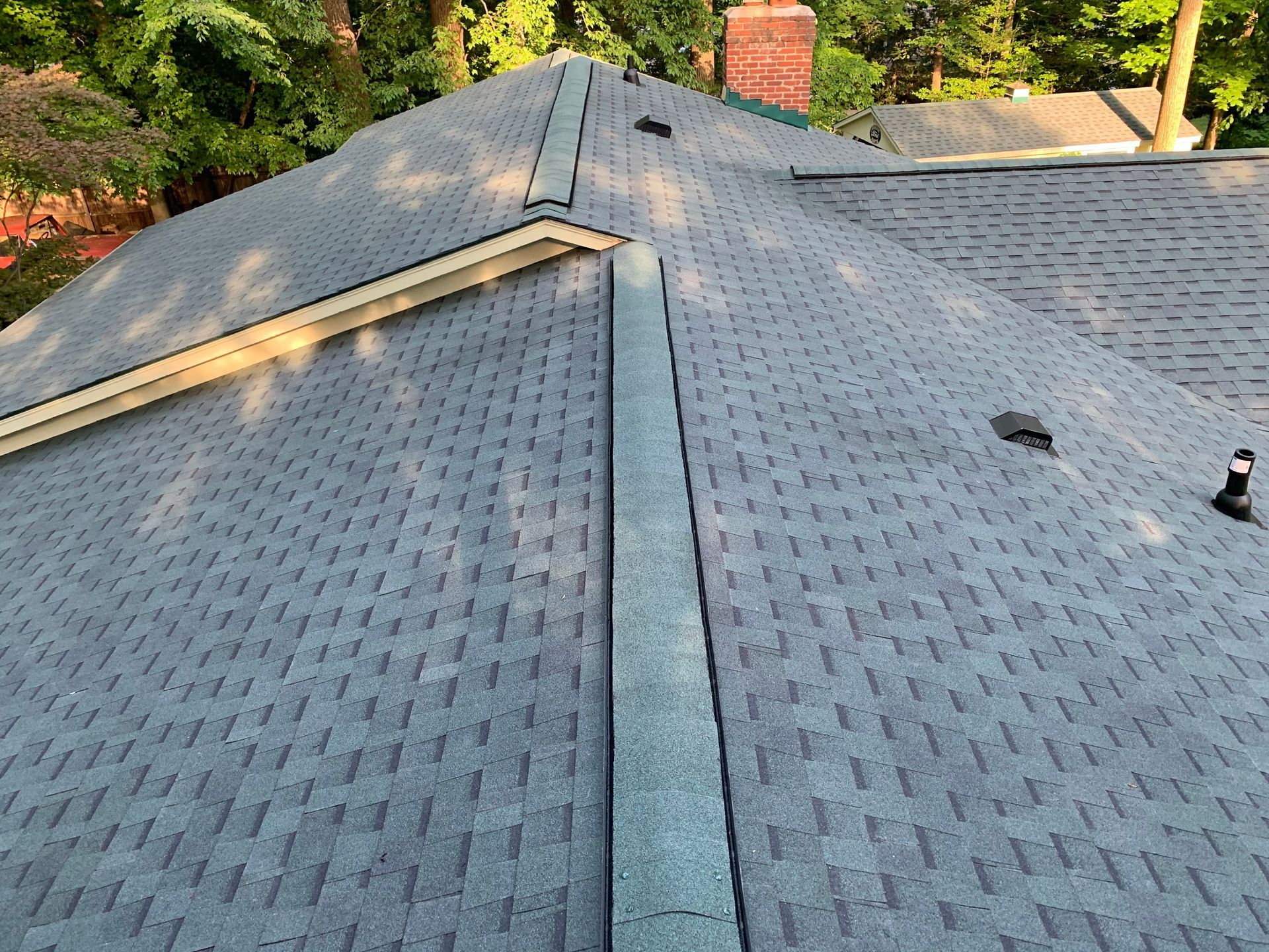 There is a skylight on the roof of a house.