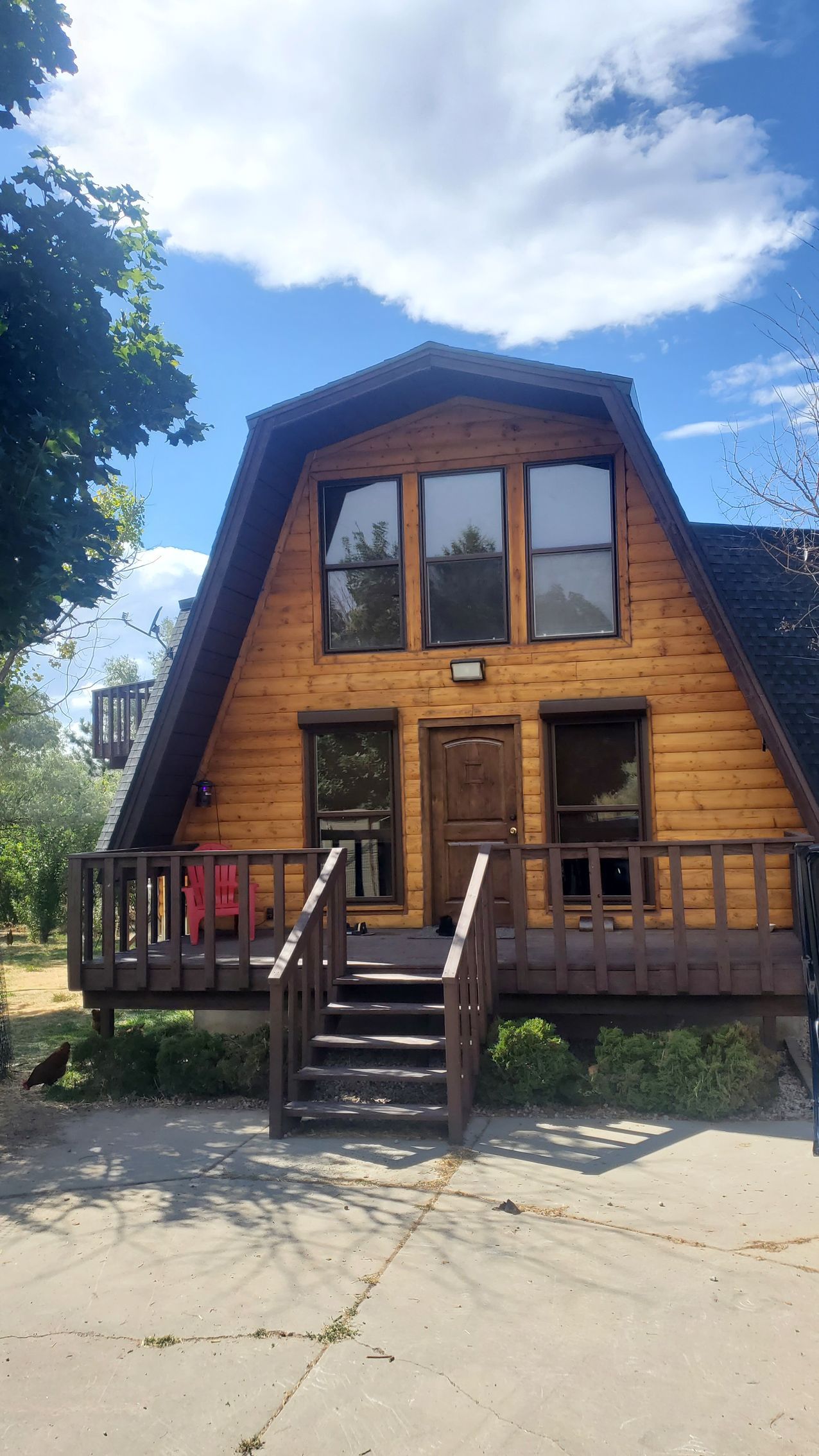 A house with a large deck and lots of windows