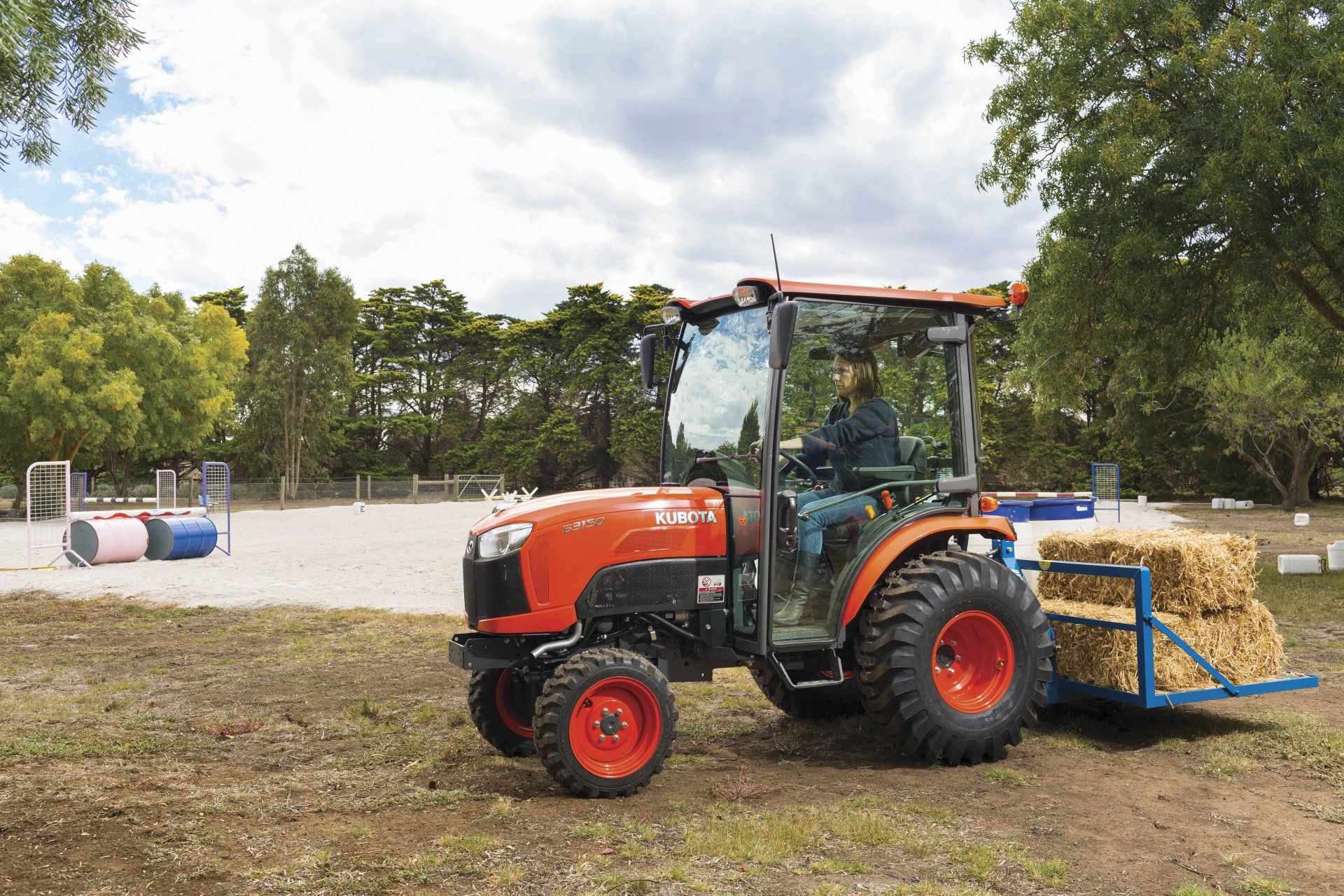 Agricultural Tractor Mowing Grass  — Machinery Sells In Dorrigo, NSW