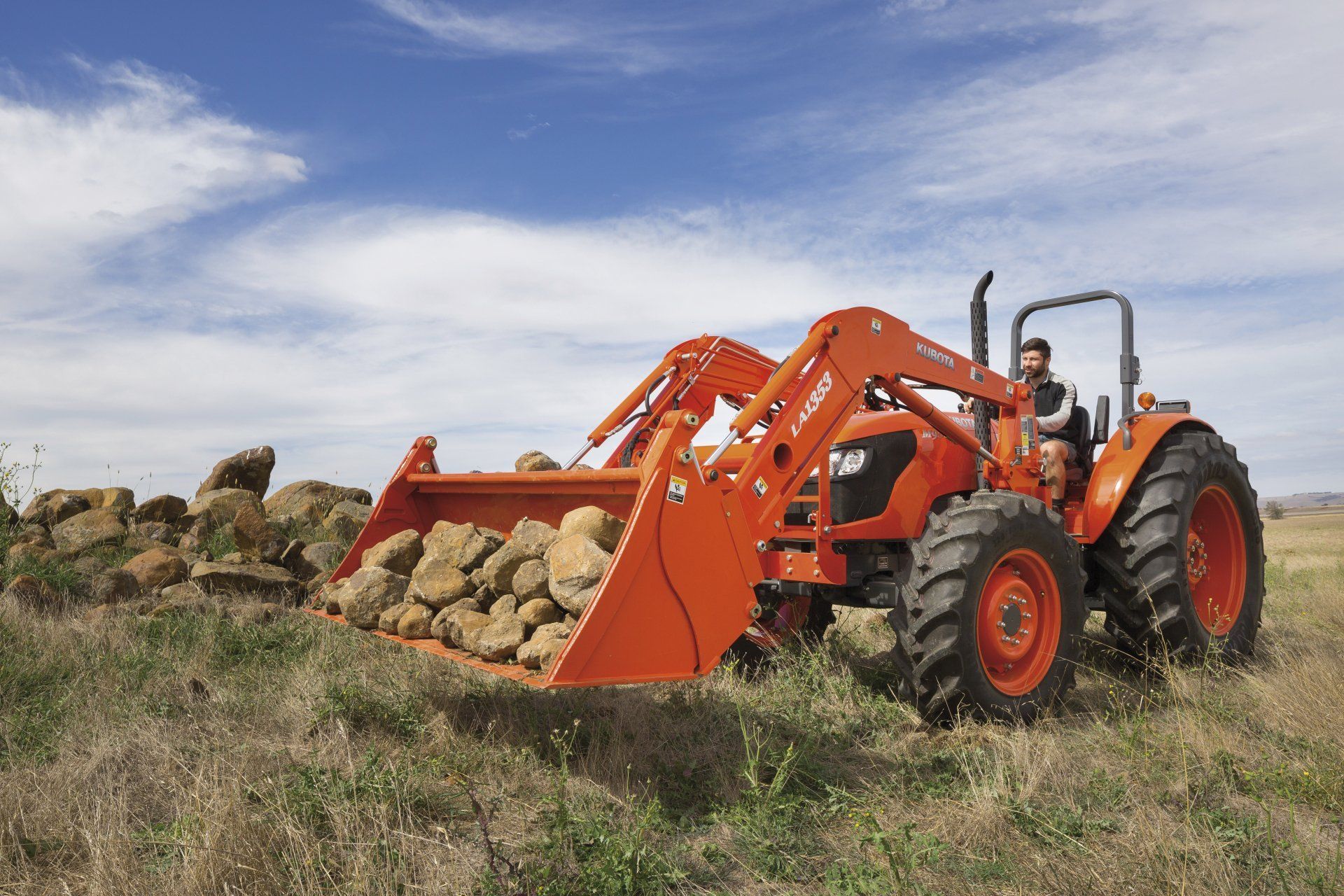 Modern Red Tractor In The Agricultural Field — Machinery Sells In Dorrigo, NSW