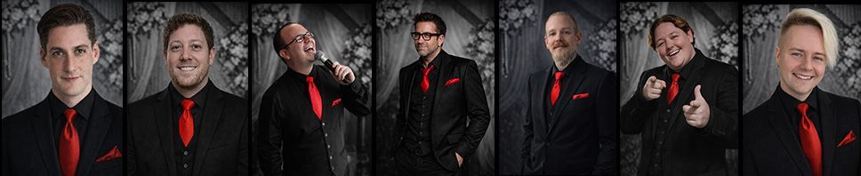 A group of musicians in formal attire, posing against a textured grey backdrop.