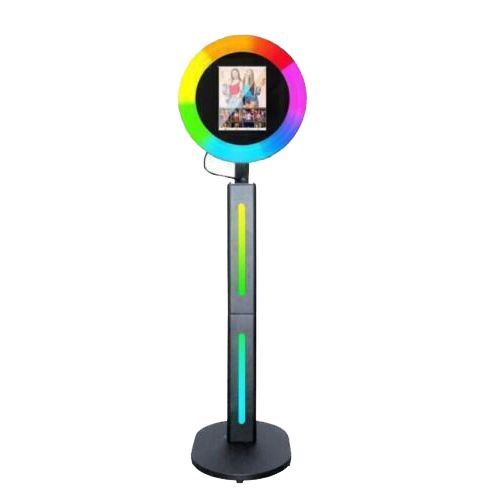 A photo booth with a rainbow colored circle on top of it.